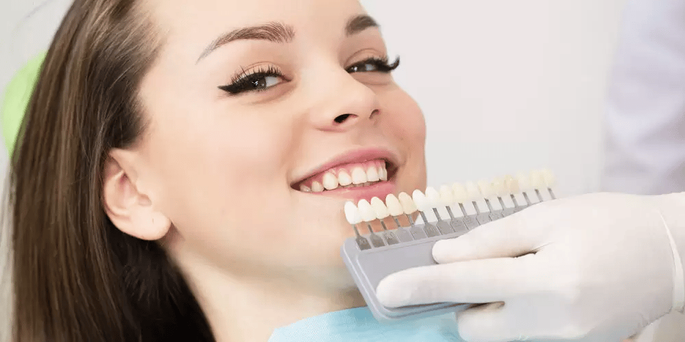 person checking what shade of teeth they want