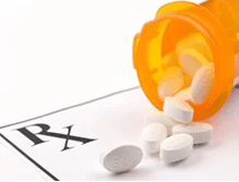 pills falling out of a bottle